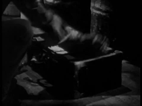 Man setting time bomb in trunk Stock Footage 260255569