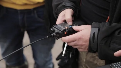 Man is setting walkie talkie Video stock 75218780