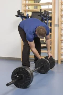 Man, setting up, weight bar, weights Stock Photos