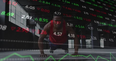 Man settling into push-up stance activating health data overlay in warehouse, 動画素材 310826331