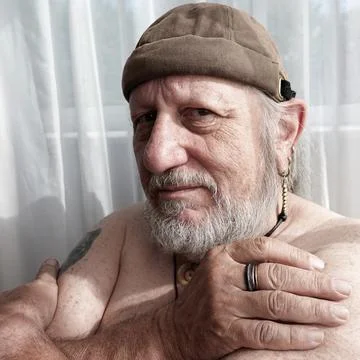Man of seventy with a docker cap Foto stock