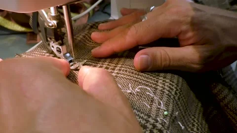 A man sewing Stock Footage 137411734