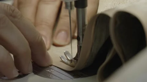 Man sewing lashing on a sewing machine Stock Footage 276870308