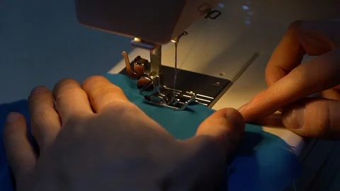 A man sews fabric 库存影片 119071583