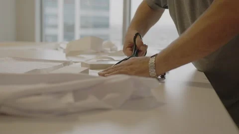 Man sews at a sewing machine. Designer sitting and sewing. Dressmaker working on 스톡 동영상 254485052