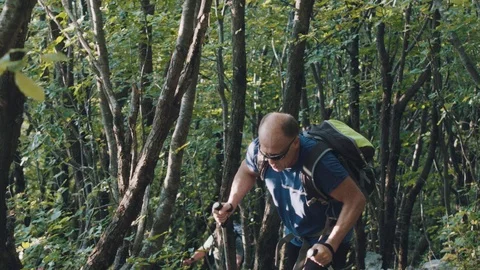 Man In The Shade Of The Forest, Looking To Reach The Top Of The Mountain Stock Footage 93661080