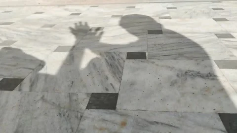 Man shadow is rubbing both hands together Stock Footage 293291126