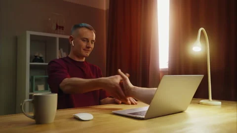 Man shake hand, handshake through laptop. Remote online deal distant agreement. Stock Footage 323434832
