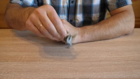 A man shakes a bunch of door keys, creating a distinctive metallic jingling s Stock Footage 341254885