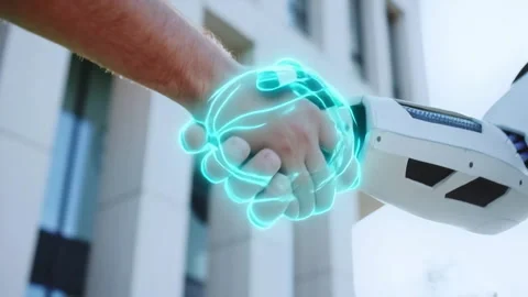 A man shakes hands with a robot, symbolizing humantech fusion Stock Footage 316828349
