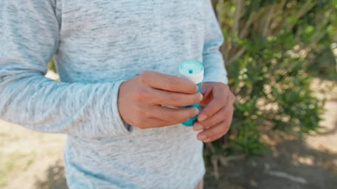 Man Shaking And Opening The Soap For Bubbles Stock Footage 277166831