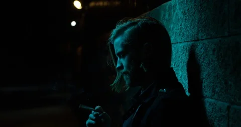 Man shaking off ash from the cigarette while smoking Video stock 111385471