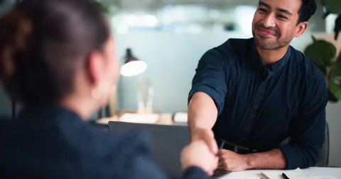 Man, shaking hands and smile for interview at office with laptop, welcome and Stock Footage 323265449