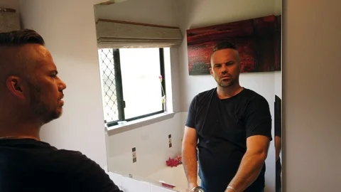 Man shaking his head to three questions answering no each time,. looking Video stock 121875173