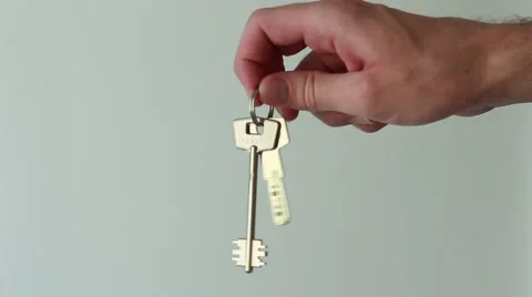 Man shaking keys of a new flat Stock Footage 65371250
