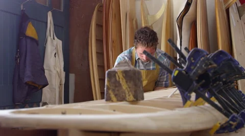 Man Shaping Custom Surfboard In Workshop Shot On RED Camera Stock Footage 64349306