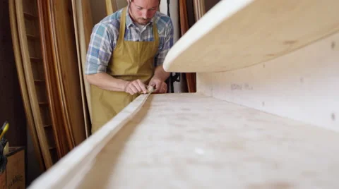 Man Shaping Custom Surfboard In Workshop Shot On RED Camera Stock Footage 64349460