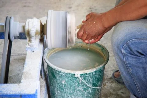 Man shaping marble using a lathe Stock Photos