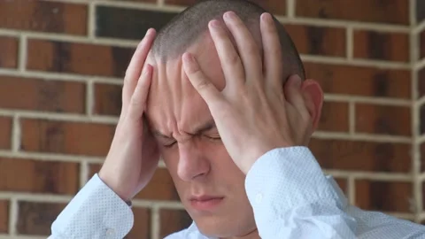 A man with a sharp attack of headache, close-up Stock Footage 201561186