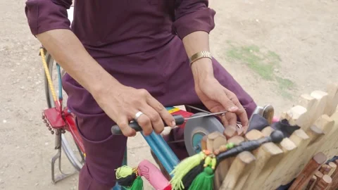 Man sharpening a knife Stock Footage 271622844