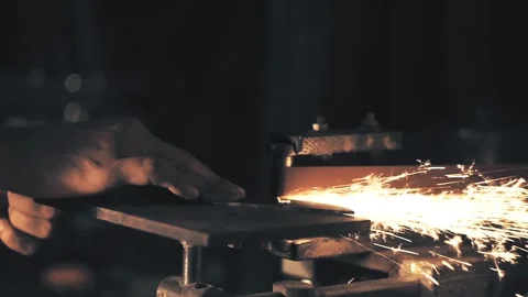 Man sharpening knife with sparks Stock Footage 136033657