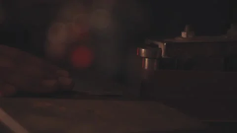 Man sharpening knife with sparks. Work on a sharpening machine. Stock Footage 134791399