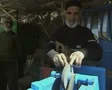 Man sharpening knife at stall SD Footage