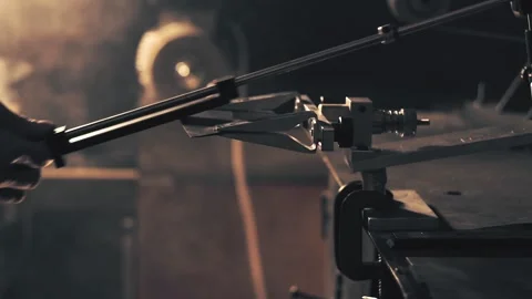 Man sharpening knife. Work on a sharpening machine Stock Footage 135076560