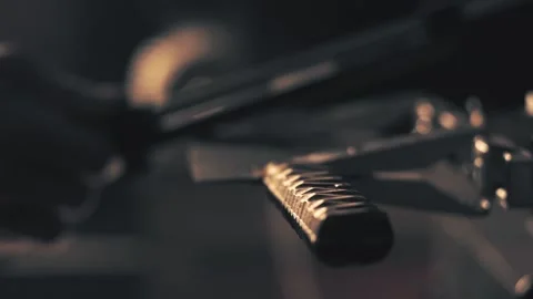 Man sharpening knife. Work on a sharpening machine Stock Footage 135079644