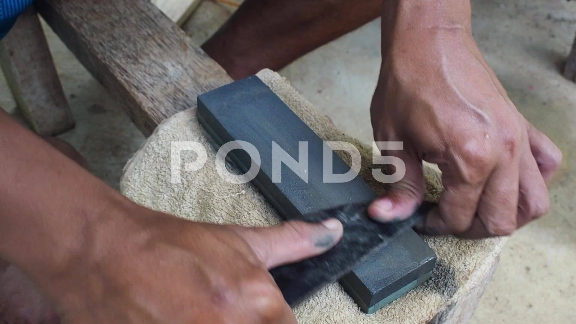 https://images.pond5.com/man-sharpening-machete-whetstone-small-footage-146055964_prevstill.jpeg