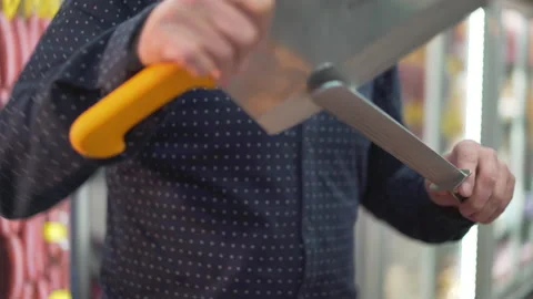 A Man is sharpening a meat knife Stock Footage 146850730