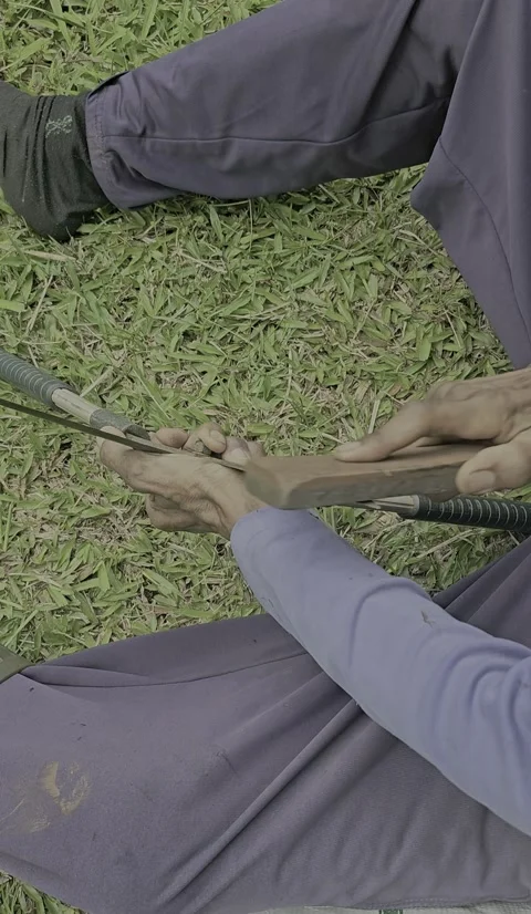 Man Sharpening plant scissors with Grinding Stone Stock Footage 296037310