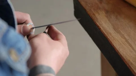Man sharpening a simple pencil with a knife. the sound of carpentry tools Stock Footage 156683509