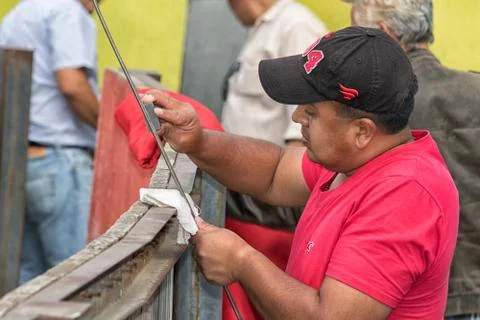 A man is sharpening torreador's sword Stock Photos