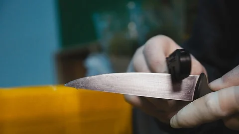 A man sharpens the knife Close up Stock Footage 119703384