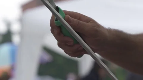 Man sharpens a knife Stock Footage 82022732