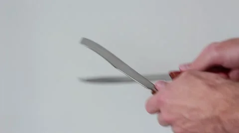 Man sharpens knife with knife Vídeo Stock 65371933