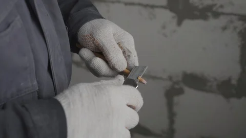 Man sharpens a pencil with a construction knife Stock Footage 101661813