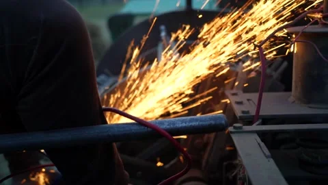 Man is sharping cutter blade with a metal angle grinder saw. Sharp sparkling  Vídeos de archivo 152028440