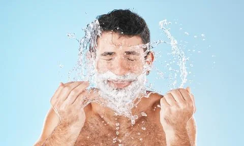 Man, shave and face with water splash in studio for wellness, health and self Stock Photos