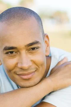 Man with shaved head smiling at camera, portrait Stock Photos