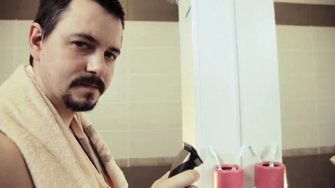Man shaves beard and mustache Stock-Footage 92406830