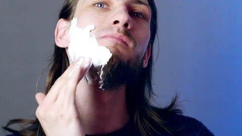 Man shaves beard Stock Footage 104239066