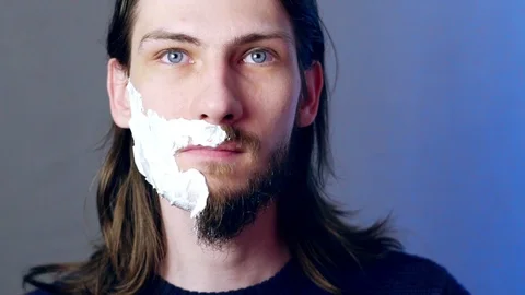 Man shaves beard Stock Footage 104239267