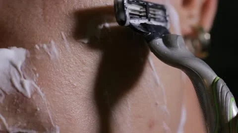 Man shaves close up Stock Footage 11890616