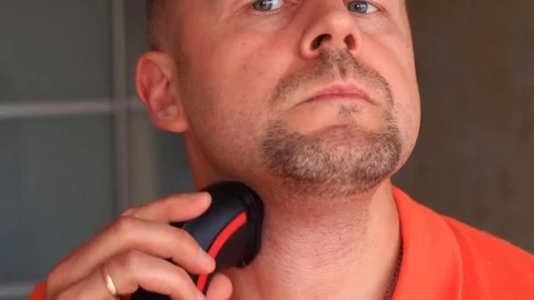 Man shaves face with razor Stock Footage 79594142