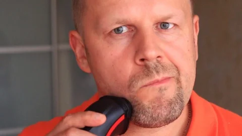 Man shaves face with razor Stock Footage 79594144