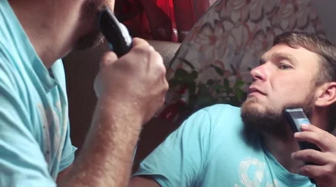 Man shaves off his beard Stock Footage