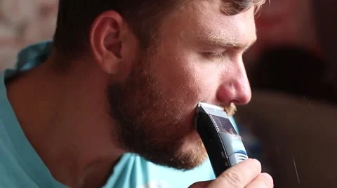 Man shaves off his beard Stock Footage