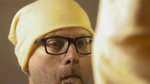 Man shaves his beard in front of the mirror. Stock Footage 143623371